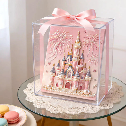 Dope 3D Castle Beaded Art Kit With Pearl Painting displayed in a clear box with a pink ribbon, on a table with macarons.