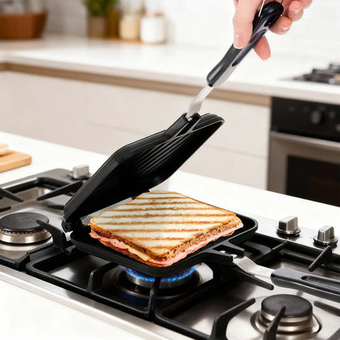 Elsjoy Stovetop Toasted Sandwich Maker Press, aluminum flip pan with handle cooking sandwich on stove.