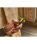 Laser Pocket Measure 12 m Handheld Distance Tool For Pros, Contractors, And DIYers, Compact And Durable Laser Measurer With Quick Readouts, Accurate Measurements, Ideal For Carpentry, Interior Design, And Renovations Model STHT77666-0 held in hand