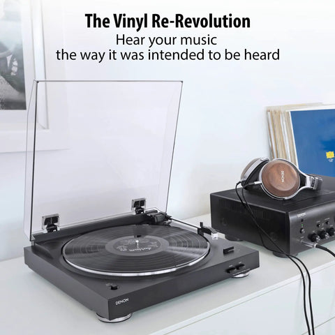 Denon Dp29F Fully Automatic Analog Turntable With Built In Phono Stage and transparent dust cover on display in home setting.
