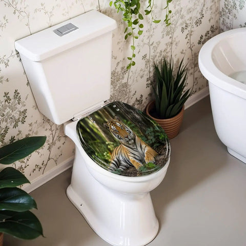 Round Tiger portrait Toilet Seat on a white toilet, showcasing tiger design, surrounded by greenery in a bathroom.