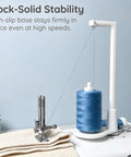 Heavy Duty Thread Spool Stand For Sewing Machines Featuring A Sick Anti Tangle Guide And Jumbo Cone Holder Totally No Sweat Bracket For Quilting Embroidery Setup Straight Up Smooth Operation In White with blue thread.