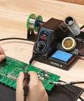 926LED V3 Beginner Friendly 60W Soldering Station Kit With Temperature Control in use on PCB assembly with helping hands.