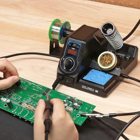 926LED V3 Beginner Friendly 60W Soldering Station Kit With Temperature Control in use on PCB assembly with helping hands.