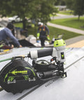 Durable Badass Pneumatic Cap Nailer Built Like Steel For Smashing Roofing Underlayment Sheets With Huge Capacity Magazine And Smooth Bump Fire Trigger Action on a roof.