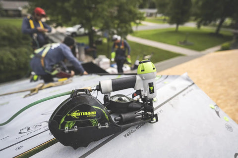 Durable Badass Pneumatic Cap Nailer Built Like Steel For Smashing Roofing Underlayment Sheets With Huge Capacity Magazine And Smooth Bump Fire Trigger Action on a roof.