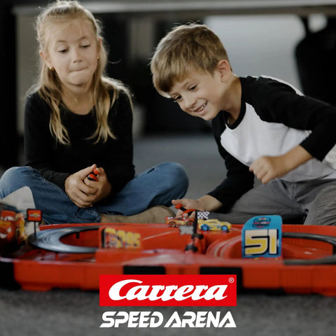 Two kids playing with Speed Arena Disney Pixar Cars Slot Car Race Track Set With Lightning McQueen And Dinoco Cruz Ramirez.