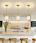 Top Shelf Modern Gold Pendant Lights 2 Pack Adjustable Crystal Chandelier Kitchen Island Fixture above a kitchen island.