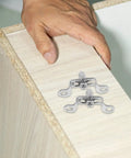 Heavy Duty Stainless Steel Furniture Fastener Kit With Invisible Three In One Connectors And Knockout Joint Screws For Straight Shots On Tight Cabinet Fixes Today, shown installed on cabinet edge.