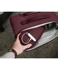 Hand accessing side pocket of Lineate Softside Expandable Go To Carry On Luggage with Spinner Wheels Cedar Green Effortless Glide.