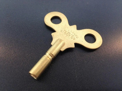Antique Clock Key N6 Replacement Part Three Point Six Millimeter Solid Brass DIY Clock Assembly Kit on dark background
