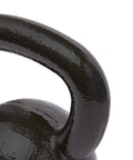 Close-up of the wide comfort grip on the Rock Solid Cast Iron Kettlebell Thirty Five Lb Weight for effective strength training.