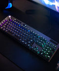 Pro Grade Low Profile Mechanical Keyboard Built For Speed Freaks Who Want Next Level Response Times plus Dynamic Animations and Lightsync Customization via Software that Makes Your Setup Look Absolutely Fire Every Single Gaming Session on a desk with RGB lighting.