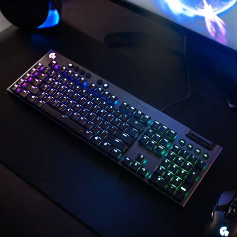 Pro Grade Low Profile Mechanical Keyboard Built For Speed Freaks Who Want Next Level Response Times plus Dynamic Animations and Lightsync Customization via Software that Makes Your Setup Look Absolutely Fire Every Single Gaming Session on a desk with RGB lighting.