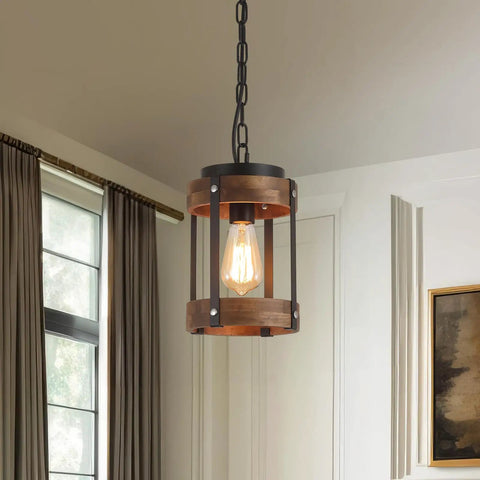 Rustic Farmhouse Pendant Lights Two Pack In Solid Oak And Matte Black Metal Cages With Long Adjustable Chains hanging from ceiling.