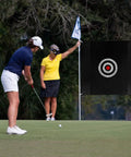 Golfer practicing with 57 Inch Silent Golf Practice Net With Colorful Target Cloth For Indoor And Outdoor Training in backyard