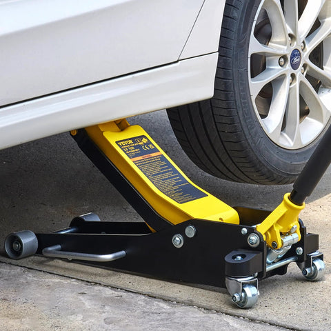 VEVOR 3-ton low-profile floor jack, yellow and black, side view under a car