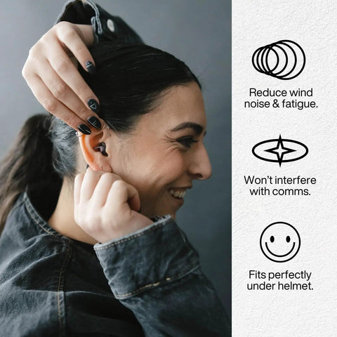 Woman inserting reusable motorcycle earplugs for riders with wind noise protection and high fidelity filter up to 26dB, comfortable fit.