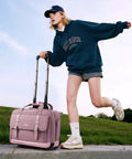 Person using a pink Rolling Laptop Bag For Women With Dual Lock And Wheels 16 Inch Computer Briefcase TSA Friendly Locks for travel.
