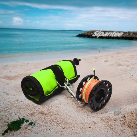 DSMB Kit For Scuba Diving With Five Foot Tube And Ninety Eight Foot Reel Marker Buoy on beach