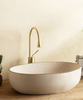 Retro Oval Ceramic Vessel Sink for Bathroom Vanity, modern design with a dark brushed texture, size 22.8x15.7x5.1 in.