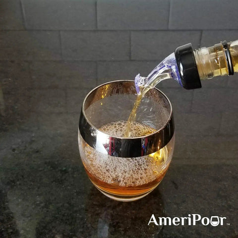 3 Pack Measured Liquor Pourers With Collared 3 Ball Design BPA Free No Leaks No Cracks Made In USA Perfect 1.5 Oz Pour Every Time Great For Wine Clear Bar Spouts pouring liquor into a glass