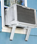 Heavy Duty No Drill Window AC Bracket That Holds Up To 200 Lbs in use with white window air conditioner on blue wall exterior.