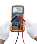 Hands using Flexible Multimeter Test Lead Kit with CAT III 1000V 10A safety on digital multimeter, gold plated 4mm probes.