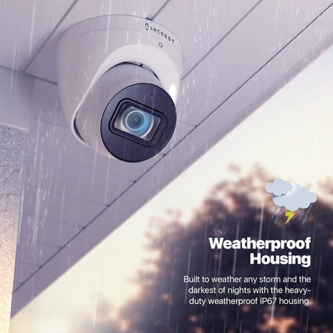 4K Analog Turret Outdoor Security Cam 8MP At 15fps With Coax BNC CCTV 65ft Night Vision 125 Degree Field Of View Built In Mic Weatherproof IP67 White DVR Not Included mounted on wall in rain demonstrating weatherproof housing