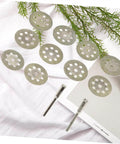 Ten Piece Diamond Cutting Discs Set For Rotary Tools with two metal rods and ultrathin blades on a white surface.