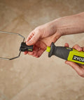 4V Cordless Hot Foam Cutter With 2.0Ah Battery held with for ergonomic use, showcasing wire tips for model making.