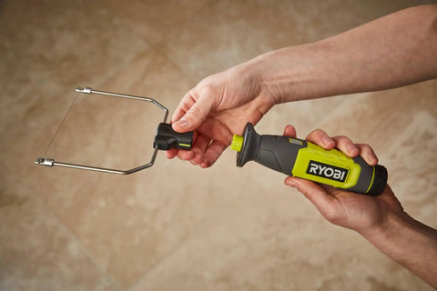 4V Cordless Hot Foam Cutter With 2.0Ah Battery held with for ergonomic use, showcasing wire tips for model making.