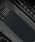 50 In One Precision Screwdriver Set With Magnetic Bits And Case For Electronics Repair next to keyboard