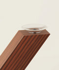 Close-up of walnut-colored 28 inch heavy duty table leg with suction cup and pre drilled hole for glass marble wood tops