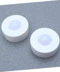 Two round lights from the Six Pack LED Cabinet Lights Set With Dimmable Warm White Under Cabinet Lighting For Cupboards Kitchen And Office Use.