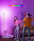 Couple dancing next to Smart RGBCW LED Floor Lamp with Alexa and Google Home, 25W dimmable torchiere, color changing light in living room