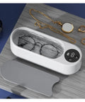 This Slick Little Ultrasonic Cleaner Machine Packs A Serious Punch With A Roomy 300 ML Tank, cleaning glasses, rings, and jewelry.
