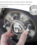 Installation of Four Pack Hub Centric Rings 56 To 73 Mm Wheel Center Bore Adapters on a car wheel for stability.
