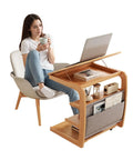 Woman using C Shaped Rolling Side Table With Wheels Solid Wood 4-In-1 Adjustable Desktop under sofa by chair