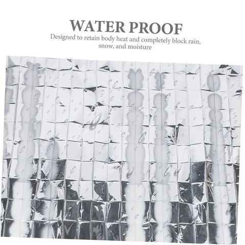 Close-up of silver Go-To 6-Piece Survival Emergency Blanket with waterproof text, reflective foil for outdoor use.