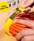 Hand securing extension cord with 9 Inch Red Quick-Strap Cord Wraps, 12 Pack Hook And Loop Straps For Extension Cords, Hoses, Ropes, and Cables.