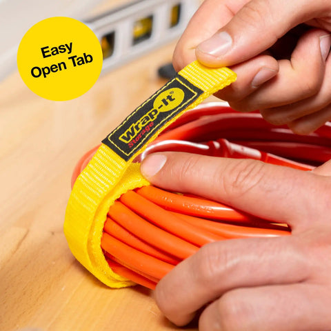 Hand securing extension cord with 9 Inch Red Quick-Strap Cord Wraps, 12 Pack Hook And Loop Straps For Extension Cords, Hoses, Ropes, and Cables.