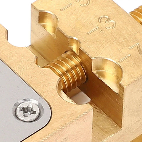 Close-up of Hassle Free Copper Watch Repair Vise Clamp With Lock Tight Mini Bench Vice Grips for precise gear assembly.
