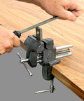 Heavy Duty Workshop Clamp Vise With 3 Inch Jaw, 20000 PSI Castings, Replaceable Hardened Steel Jaws, Compact Benchtop Design, Chrome Plated Handle And Base, Powder Coated Finish For Durable Portable Crafting clamped to a wooden bench