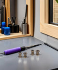 Get Your Lamps Ready With This 8 Piece Zinc Alloy Threaded Adapter Coupling Kit For Pipe Fixtures And Light Repairs Featuring Heat Resistant Build And Secure Long Thread Design To Keep Things Tight No More Loose Parts Or Broken Fittings On Your; four zinc threaded couplers on workbench