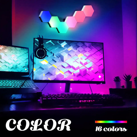 Remote Control Hexagon Wall Light Kit Smart Wall Mounted Touch Sensitive Geometric Modular RGB LED Panels DIY Colorful Light System With USB Power Includes 10 Pack For Bedroom Vibes mounted above a desk with computer monitors displaying colorful graphics.