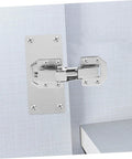 Two-piece silver screw-in hydraulic cabinet hinge installed on light gray kitchen cabinet door and frame.