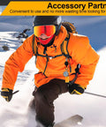 Skier wearing orange jacket uses Set Of Four Retractable Keychains With Heavy Duty Carabiner Badge Holders, Extendable Reels, And 23.6 Inch Steel Cord Plus Paracord, ID Holder Key Ring Set In Black Beige Blue Orange, Built Tough For Daily Use on snowy slope.