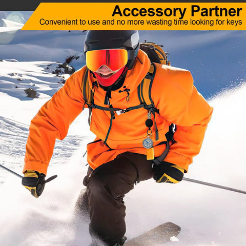 Skier wearing orange jacket uses Set Of Four Retractable Keychains With Heavy Duty Carabiner Badge Holders, Extendable Reels, And 23.6 Inch Steel Cord Plus Paracord, ID Holder Key Ring Set In Black Beige Blue Orange, Built Tough For Daily Use on snowy slope.