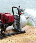 Heavy Duty Gasoline Mini Water Pump With High Lift Design And One Inch Port for efficient water movement by a riverside.